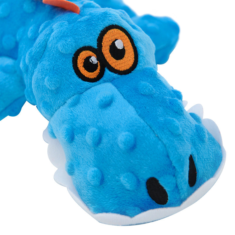 Brighty Gator squeaky crocodile dog toy – close-up of embroidered eyes and face