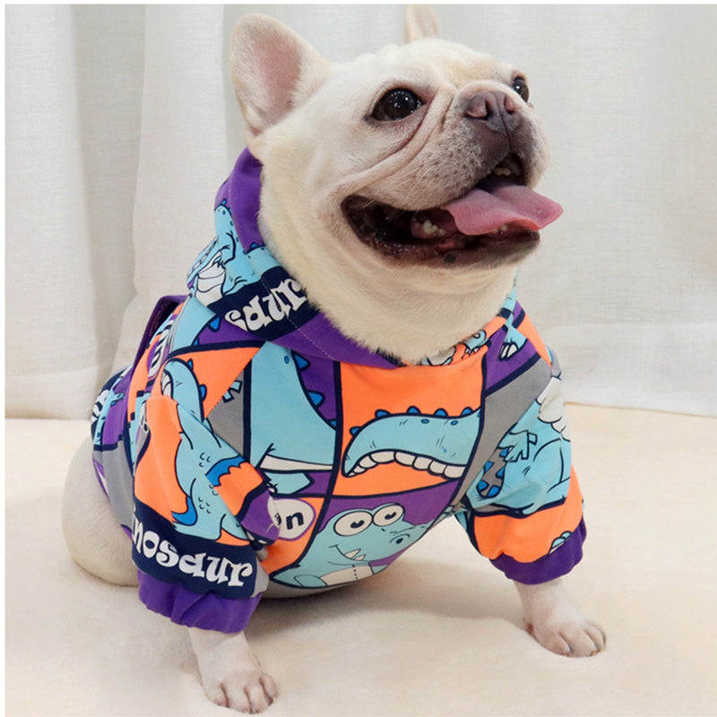 Happy French Bulldog wearing Brighty DinoWarm cozy dog hoodie with full dinosaur cartoon pattern and purple hoodie